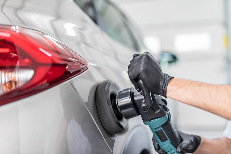 Mechanic Fixing Car Dents